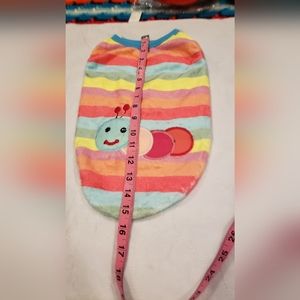 Multi-Colored Dog sweater with smiling worm on back.